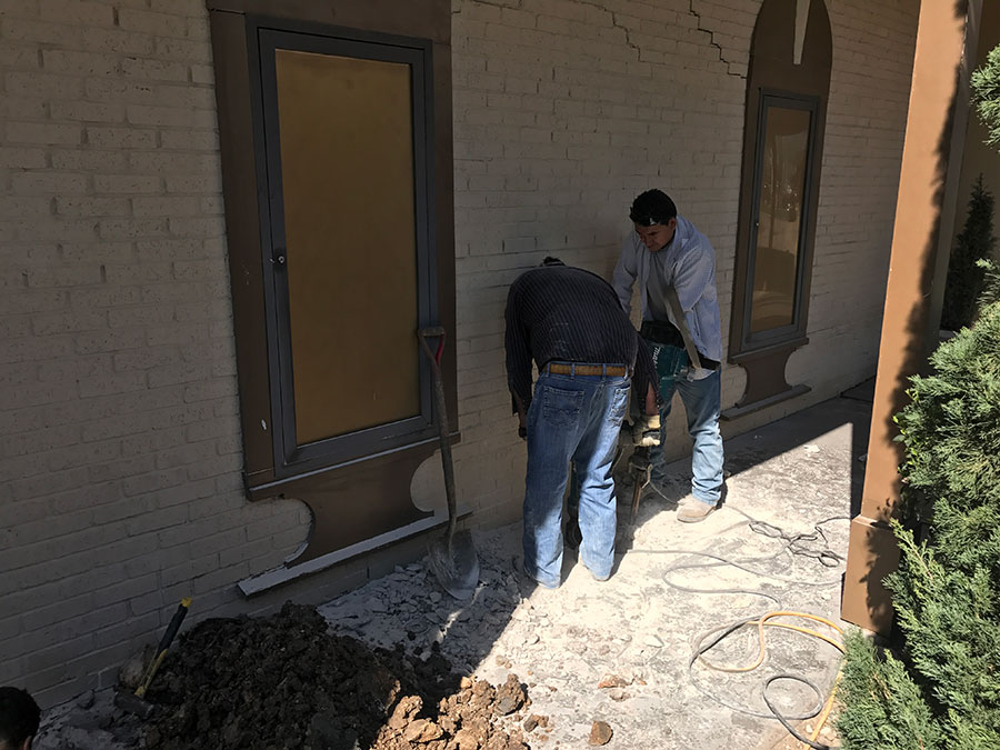 Professionals from Pier Pressure Foundation Repair working on a repair work